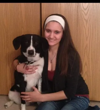 Christina with black and white dog